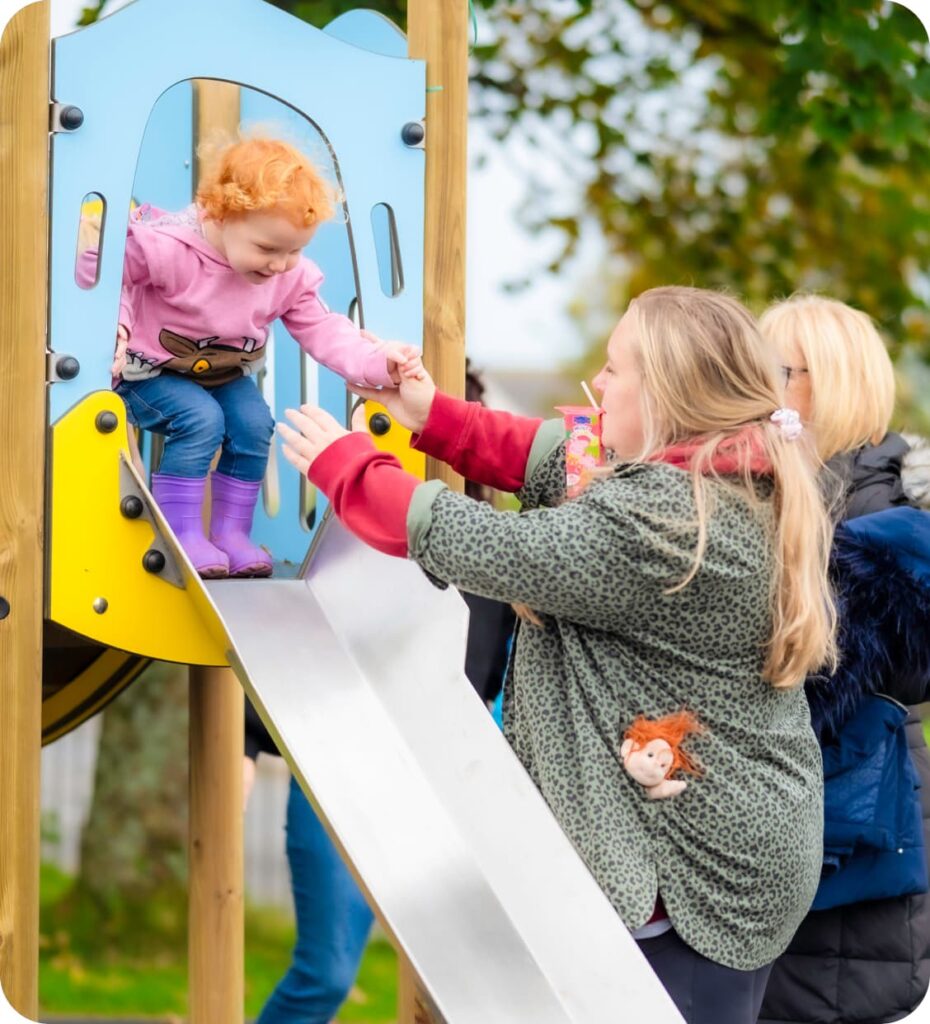 An image showing a child on a slide, representative of the kinds of projects Community Interest Funding might fund.