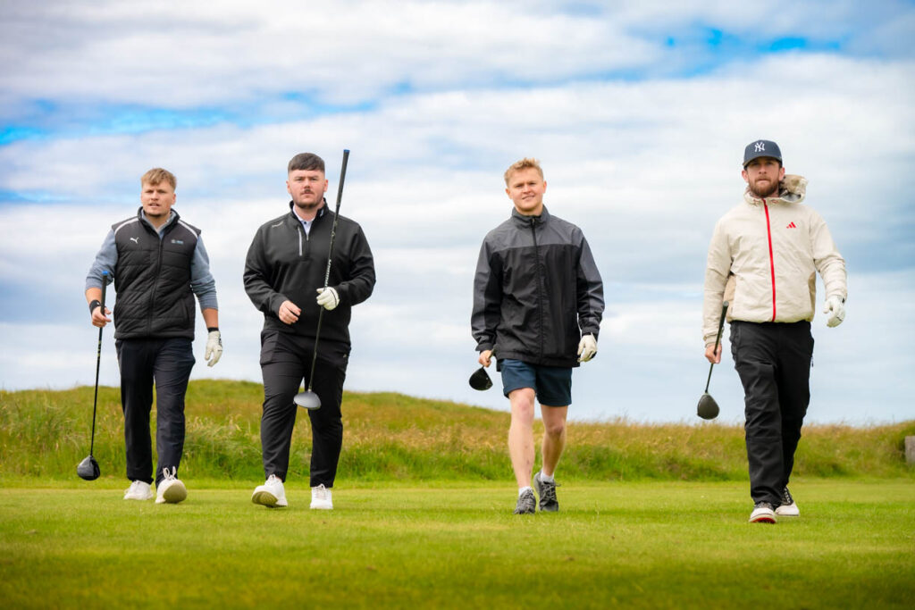 A picture of 4 golfers