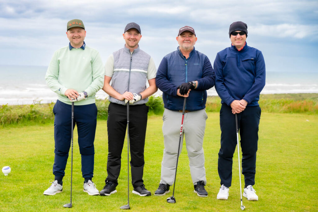A picture of 4 golfers